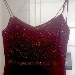 NEW WITH TAGS. Floor length Embellished deep wine chiffon gown.